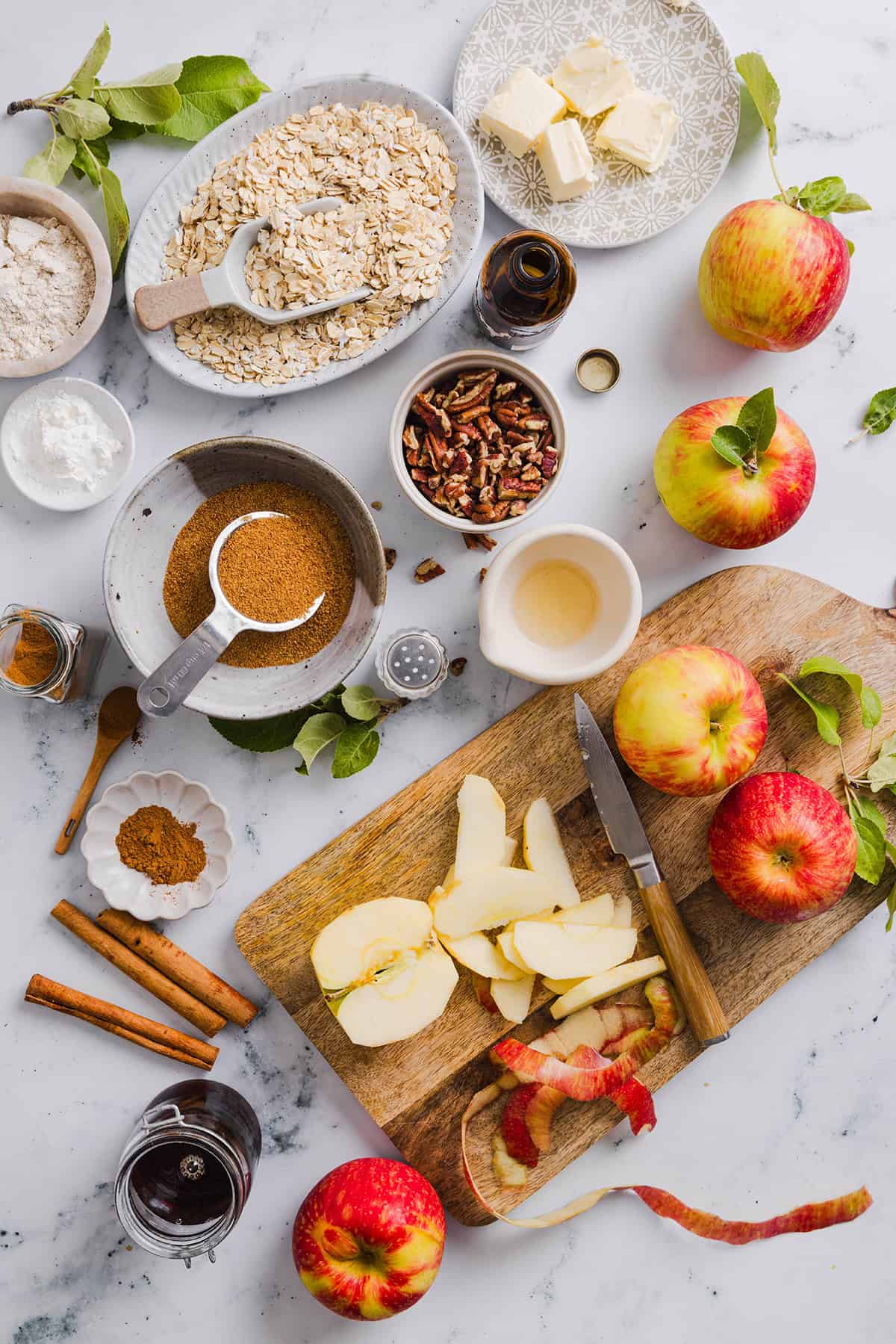 This Healthy Apple Crisp is loaded with tender apples and warm spices, naturally sweetened with maple syrup, all topped with a crunchy oatmeal pecan topping for the perfect fall dessert!