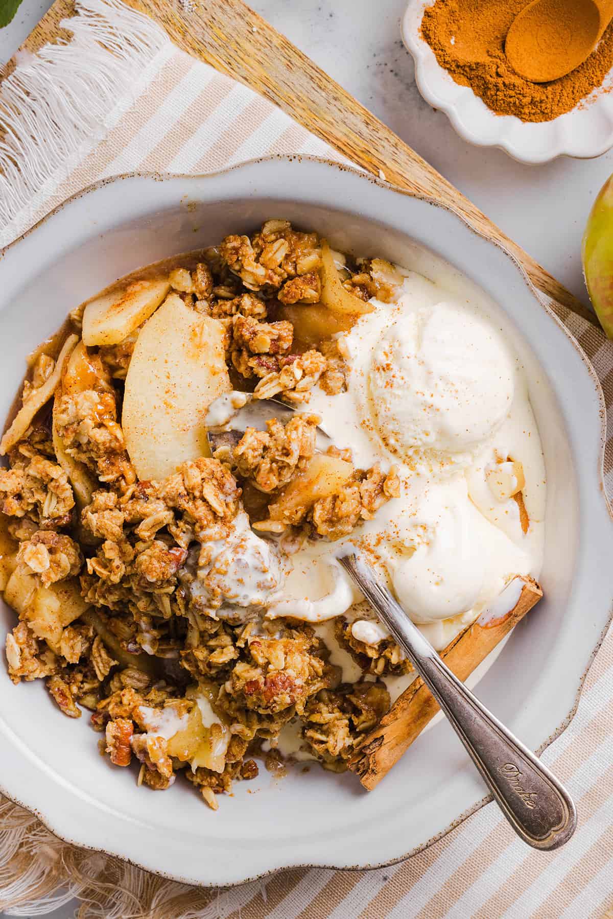 This Healthy Apple Crisp is loaded with tender apples and warm spices, naturally sweetened with maple syrup, all topped with a crunchy oatmeal pecan topping for the perfect fall dessert!