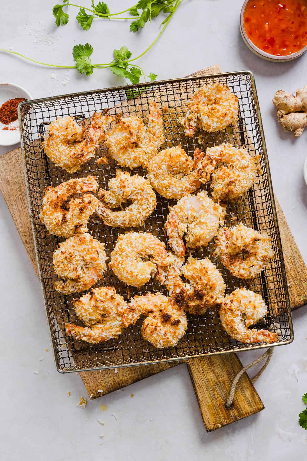 Sweet and Crispy Air Fryer Coconut Shrimp easily made in under 20 minutes and served with the most delicious chili dipping sauce! This appetizer is always a crowd-pleaser, but also makes a filling main dish served with a salad, veggies or in a wrap.