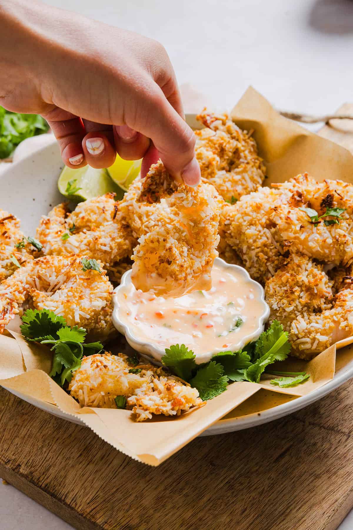 Sweet and Crispy Air Fryer Coconut Shrimp easily made in under 20 minutes and served with the most delicious chili dipping sauce! This appetizer is always a crowd-pleaser, but also makes a filling main dish served with a salad, veggies or in a wrap.