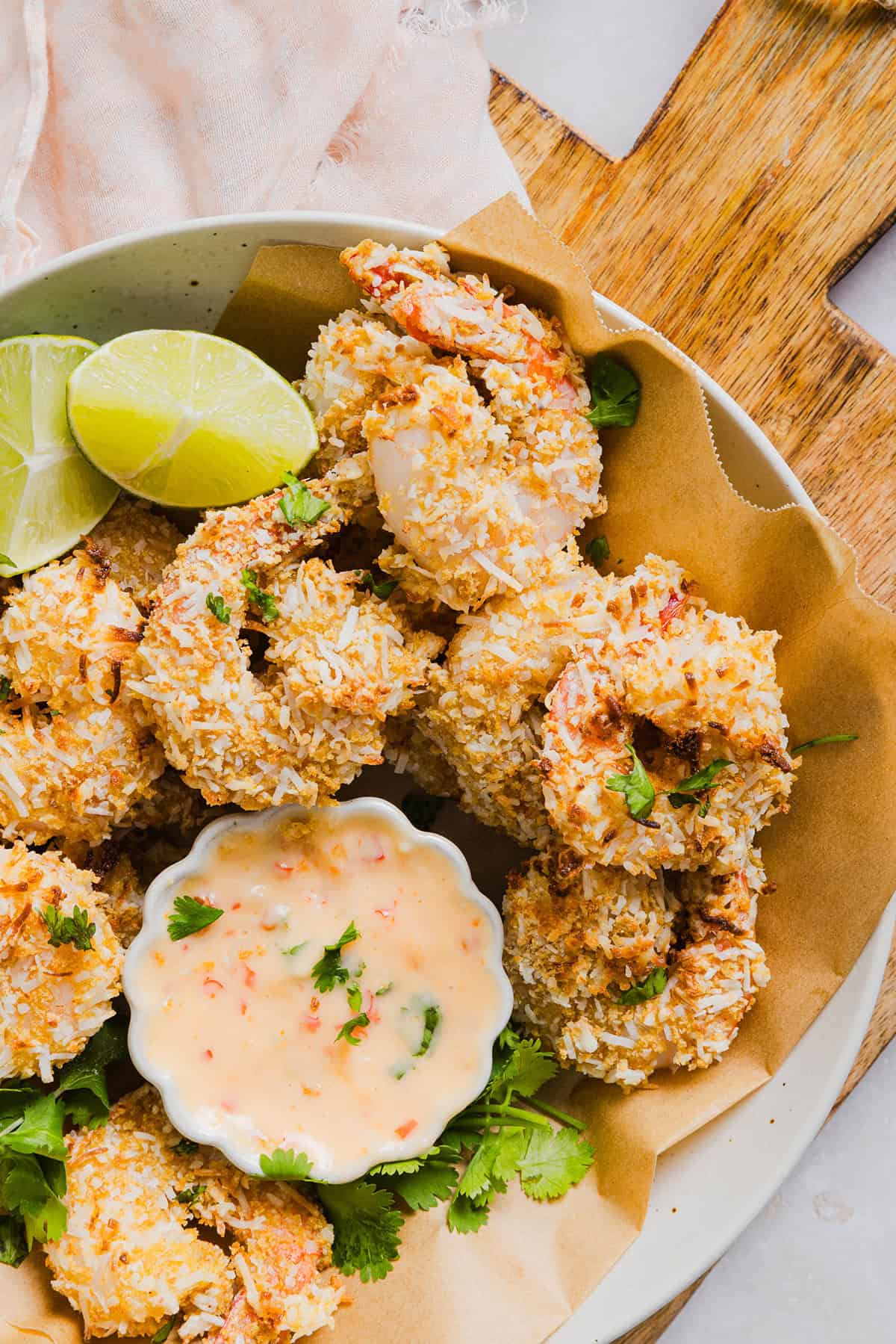 Sweet and Crispy Air Fryer Coconut Shrimp easily made in under 20 minutes and served with the most delicious chili dipping sauce! This appetizer is always a crowd-pleaser, but also makes a filling main dish served with a salad, veggies or in a wrap.