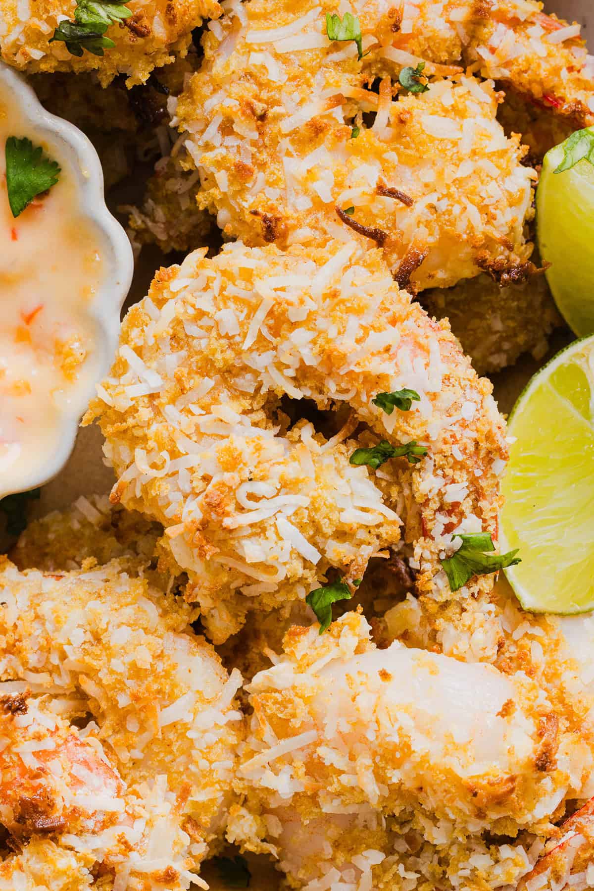 Sweet and Crispy Air Fryer Coconut Shrimp easily made in under 20 minutes and served with the most delicious chili dipping sauce! This appetizer is always a crowd-pleaser, but also makes a filling main dish served with a salad, veggies or in a wrap.