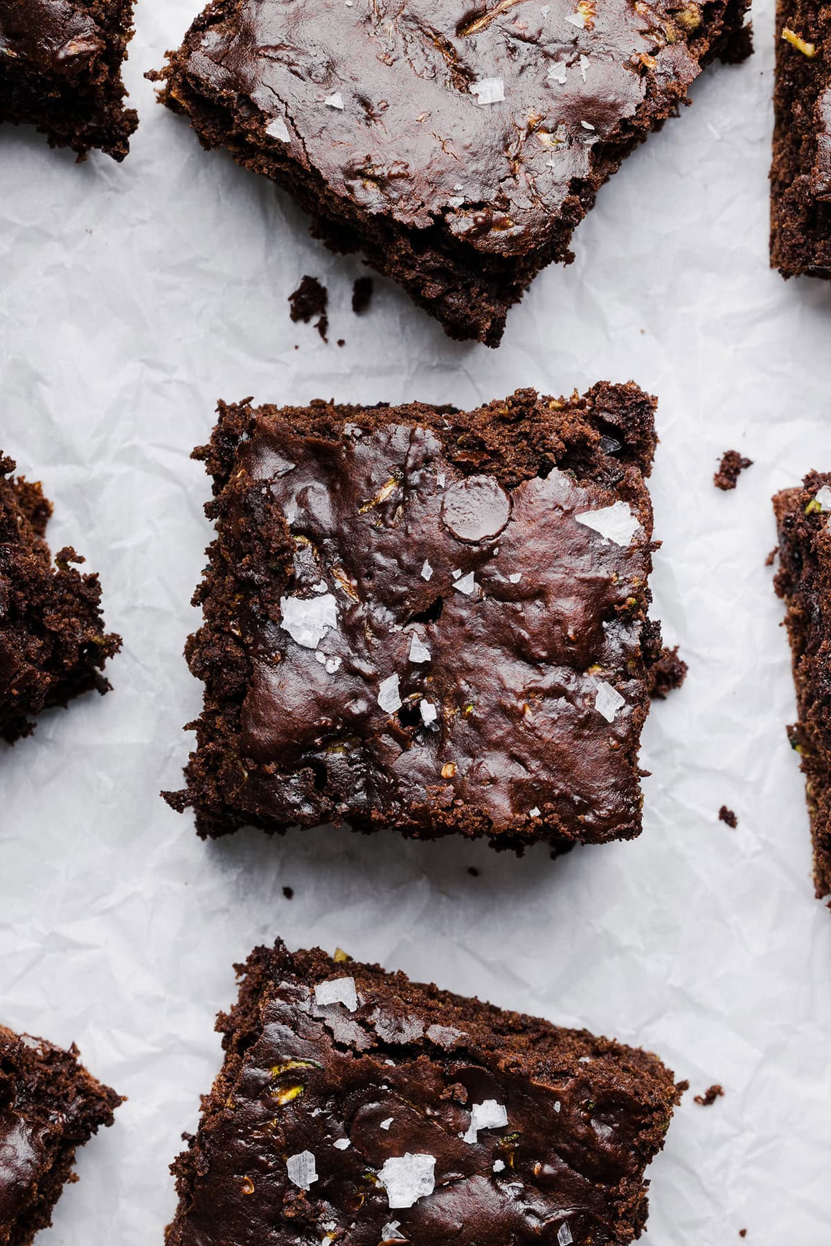 These Fudgy Zucchini Brownies are deliciously moist with a rich chocolate taste loaded with shredded zucchini and made healthier with zero butter or refined sugar! One of our family's favorite summer desserts!