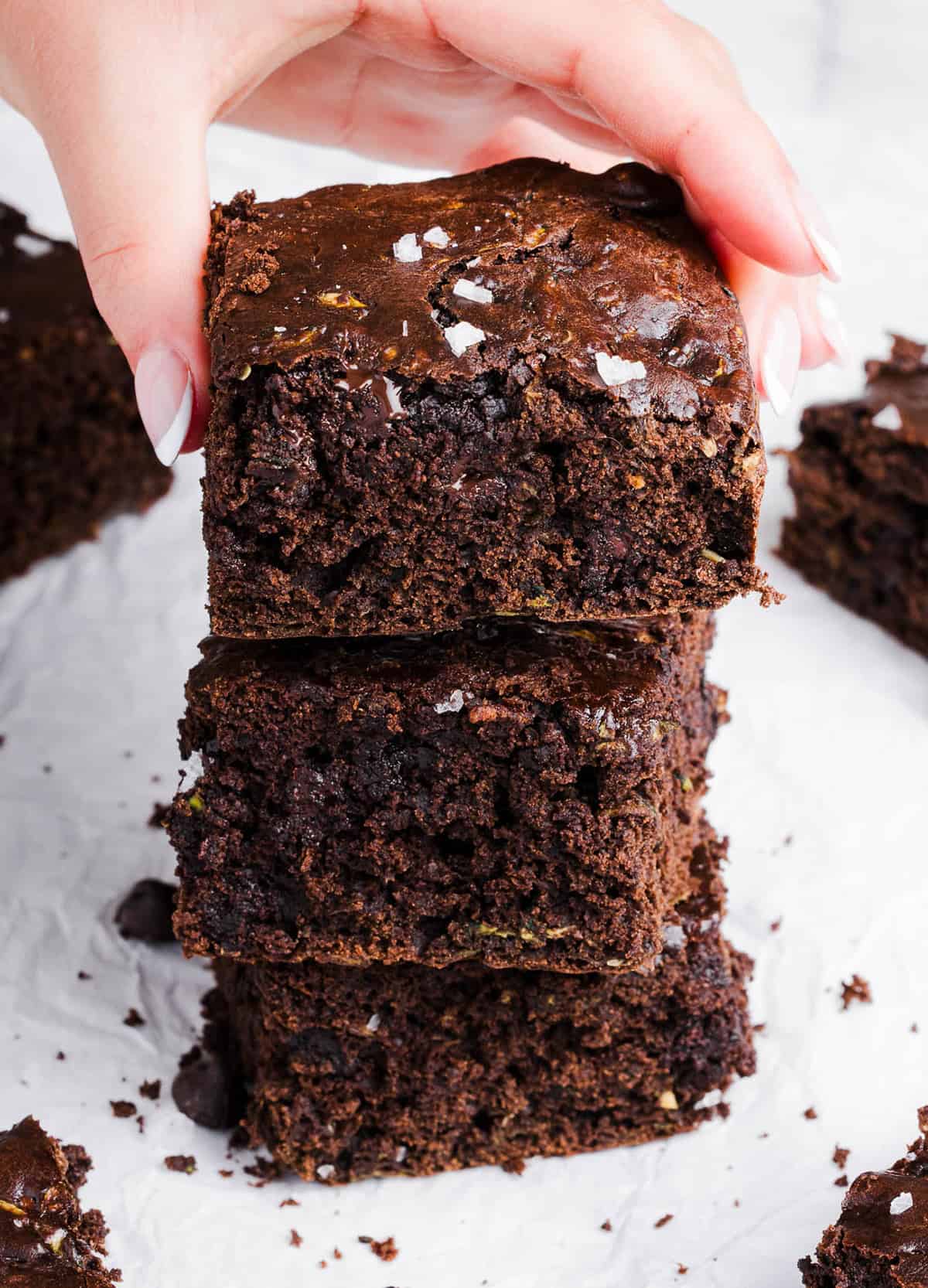 These Fudgy Zucchini Brownies are deliciously moist with a rich chocolate taste loaded with shredded zucchini and made healthier with zero butter or refined sugar! One of our family's favorite summer desserts!