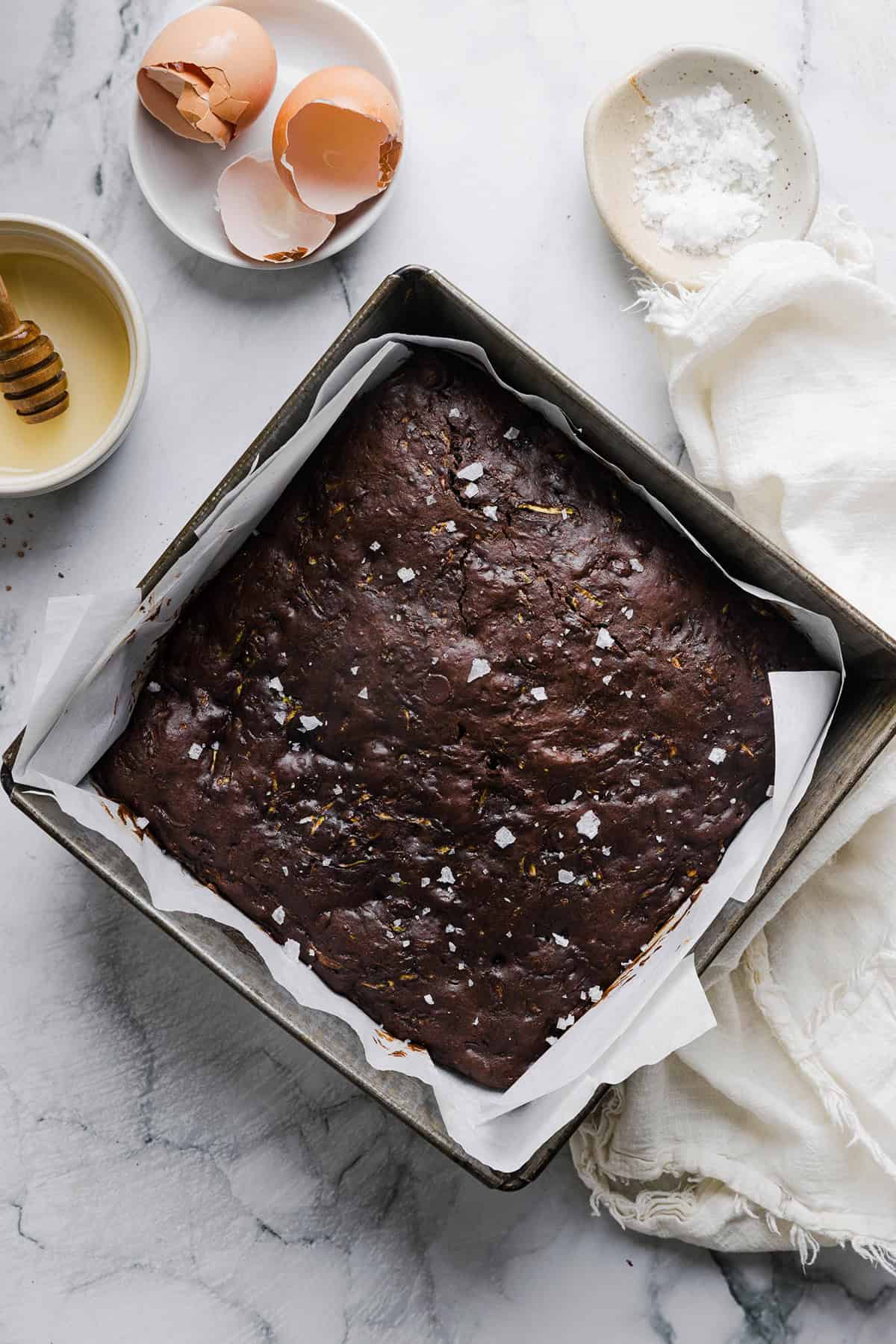These Fudgy Zucchini Brownies are deliciously moist with a rich chocolate taste loaded with shredded zucchini and made healthier with zero butter or refined sugar! One of our family's favorite summer desserts!