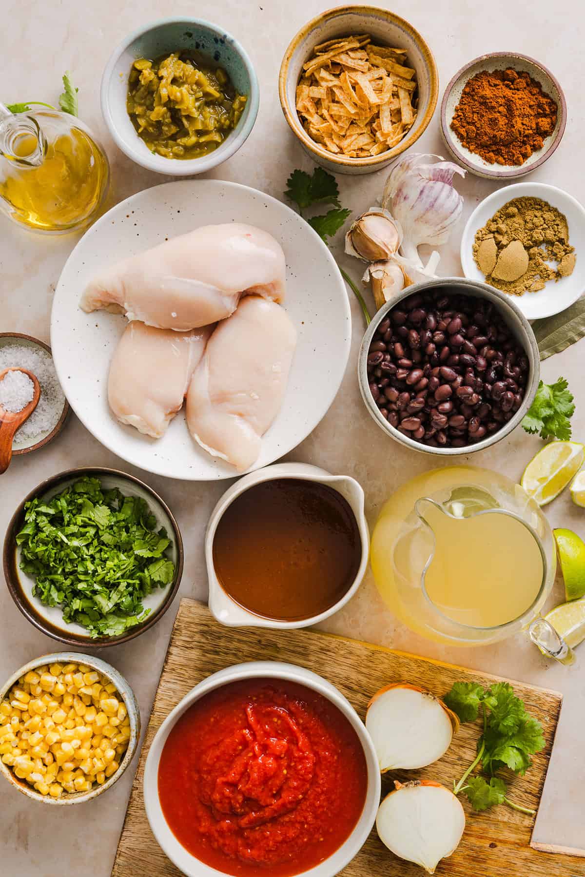 This Easy Chicken Tortilla Soup makes the perfect weeknight meal that can easily be made right in your instant pot, slow cooker or on the stove! Packed with tender shredded chicken, veggies, beans and all the toppings for a delicious, flavor-packed meal!