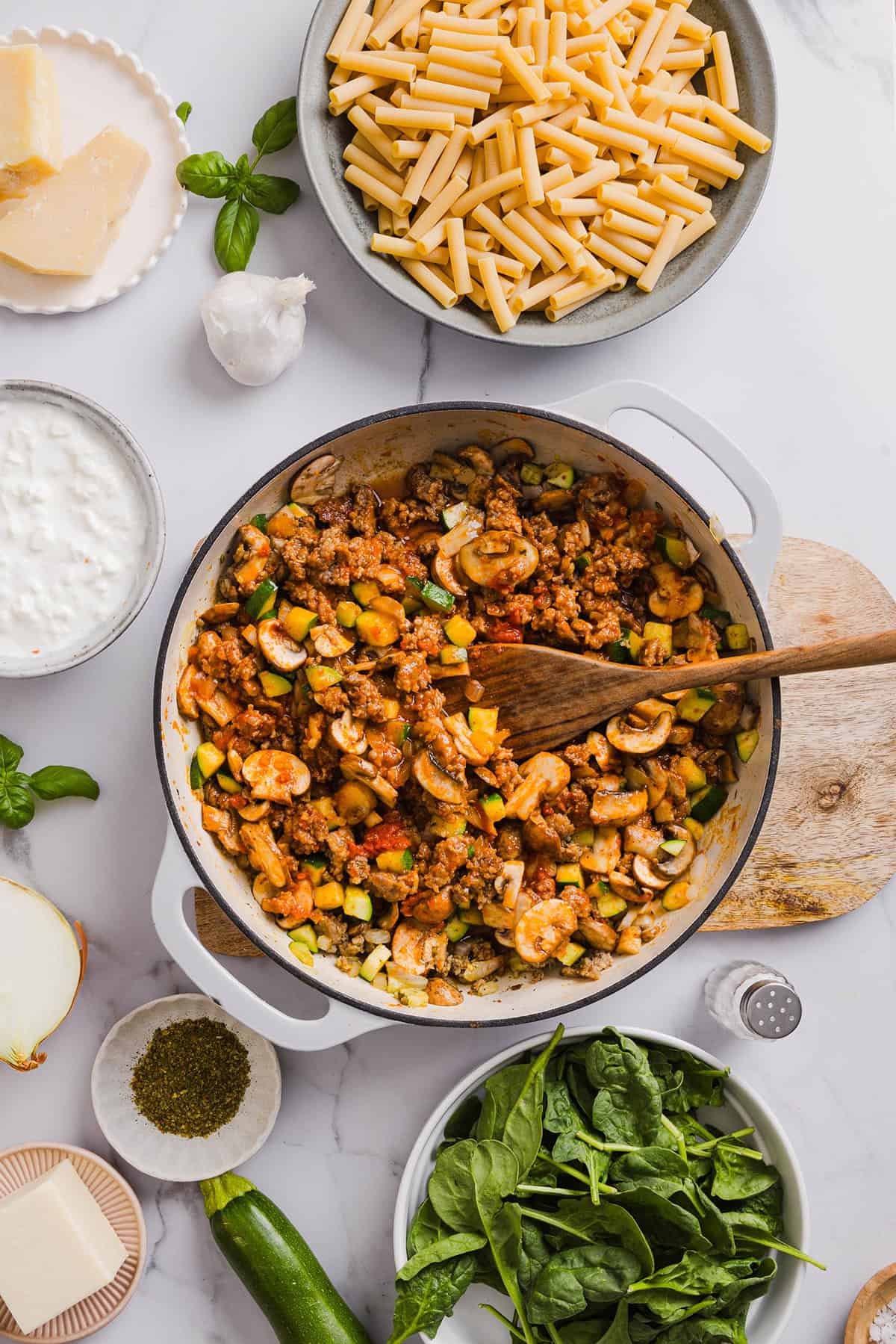 Comforting and delicious Healthy Baked Ziti packed with veggies, flavorful turkey sausage and makes the perfect weeknight meal the whole family will love! Leftovers guaranteed!