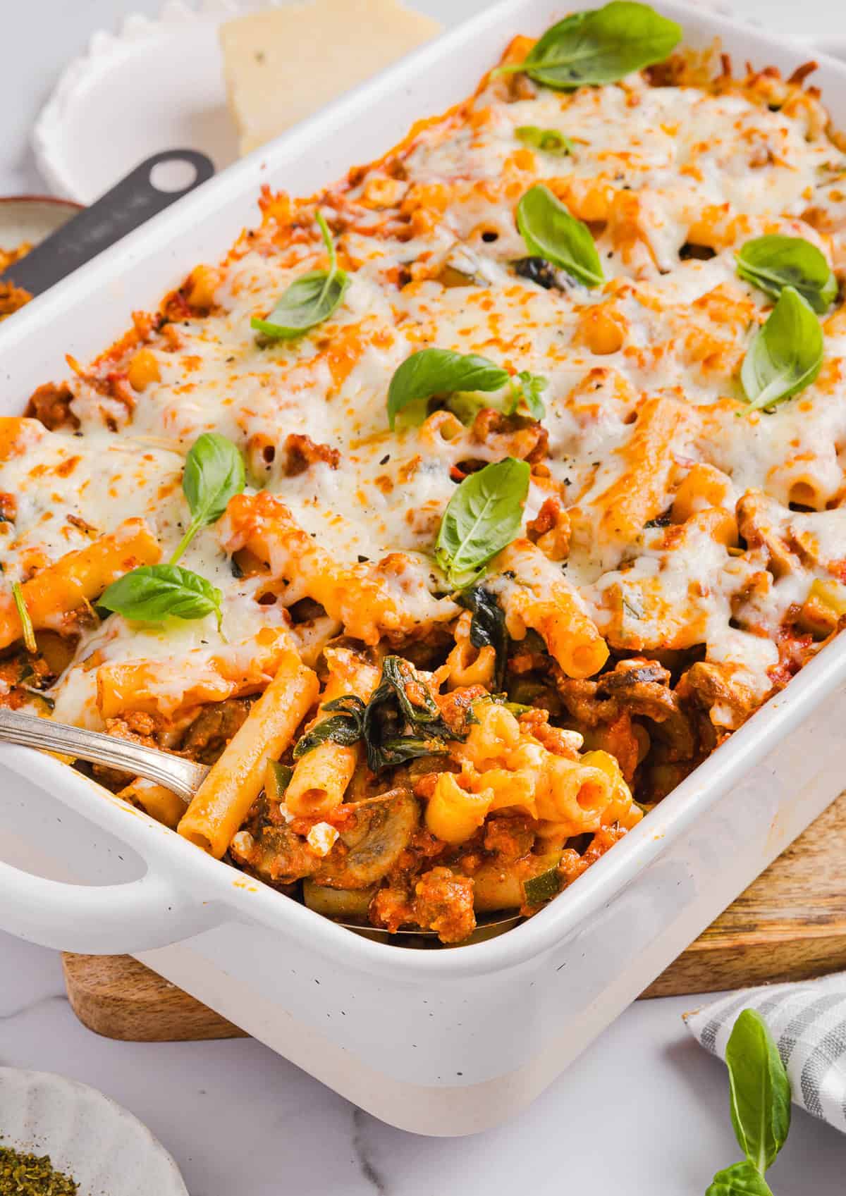 This comforting and delicious Healthy Baked Ziti recipe is packed with fresh veggies, flavorful turkey sausage and makes the perfect weeknight meal the whole family will love! Leftovers are guaranteed!
