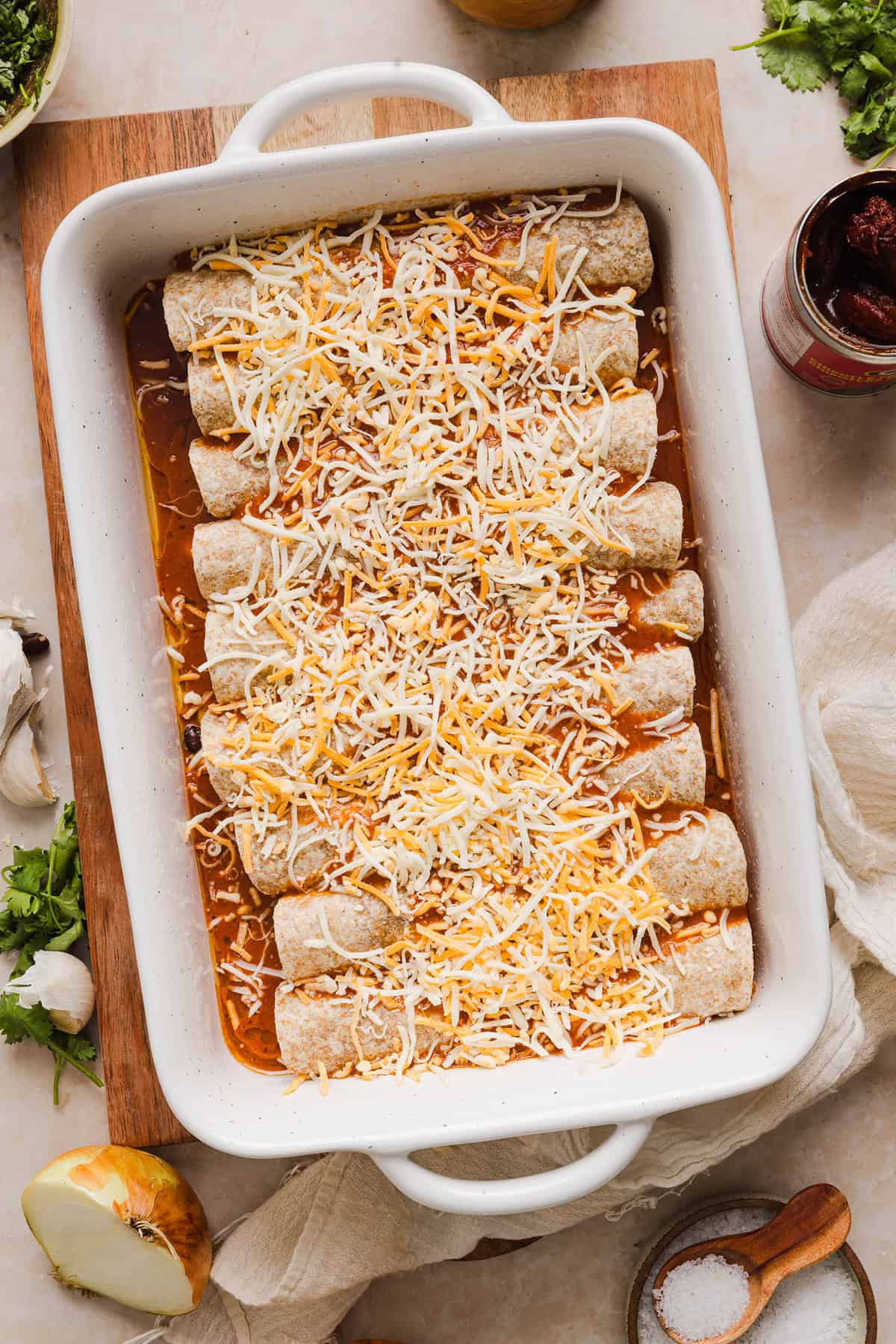 This Healthy Chicken Enchilada recipe is a family favorite made with wholesome, flavorful ingredients for the perfect weeknight meal! The homemade enchilada sauce tastes absolutely amazing!