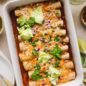This Healthy Chicken Enchilada recipe is a family favorite made with wholesome, flavorful ingredients for the perfect weeknight meal! The homemade enchilada sauce tastes absolutely amazing!