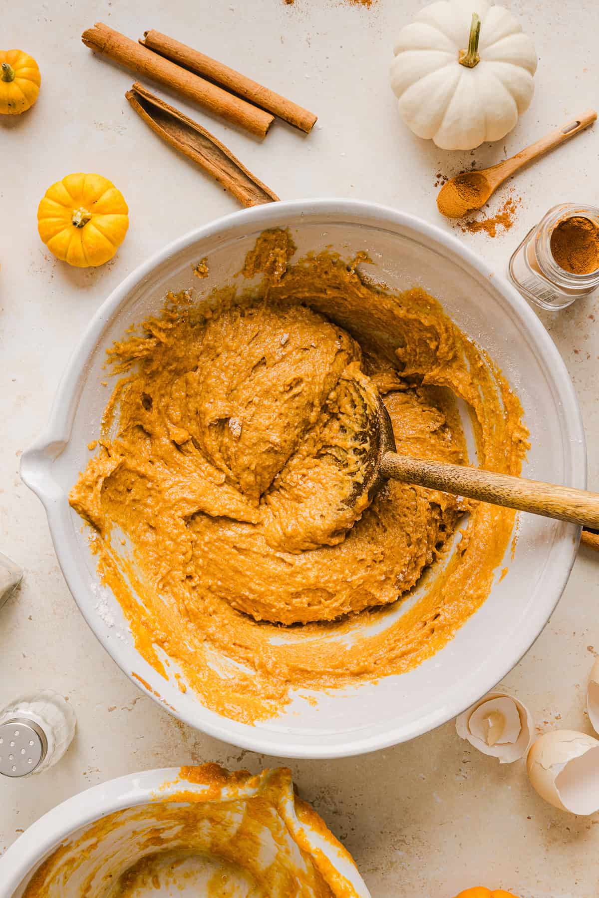 The BEST Healthy Pumpkin Bread that is moist, loaded with pumpkin flavor and made without any butter or refined sugar! Topped with a delicious maple cream cheese glaze for the perfect fall treat this season!