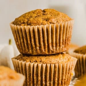 These Whole Wheat Pumpkin Muffins are moist, fluffy, and made healthier with whole wheat flour, applesauce, and zero butter or refined sugar. Loaded with delicious pumpkin flavor and warm spices for the perfect fall muffin!