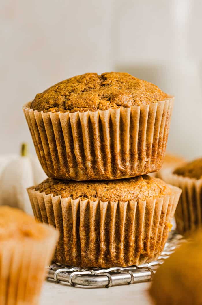 These Whole Wheat Pumpkin Muffins are moist, fluffy, and made healthier with whole wheat flour, applesauce, and zero butter or refined sugar. Loaded with delicious pumpkin flavor and warm spices for the perfect fall muffin!