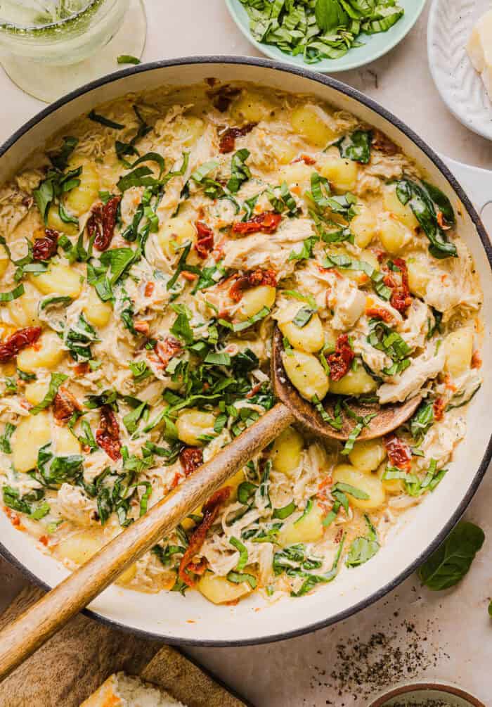 This EASY One Pan Marry Me Chicken and Gnocchi is the perfect weeknight meal! Pillowy soft gnocchi and tender chicken simmered together in a creamy sun dried tomato and parmesan sauce in just 20 minutes!